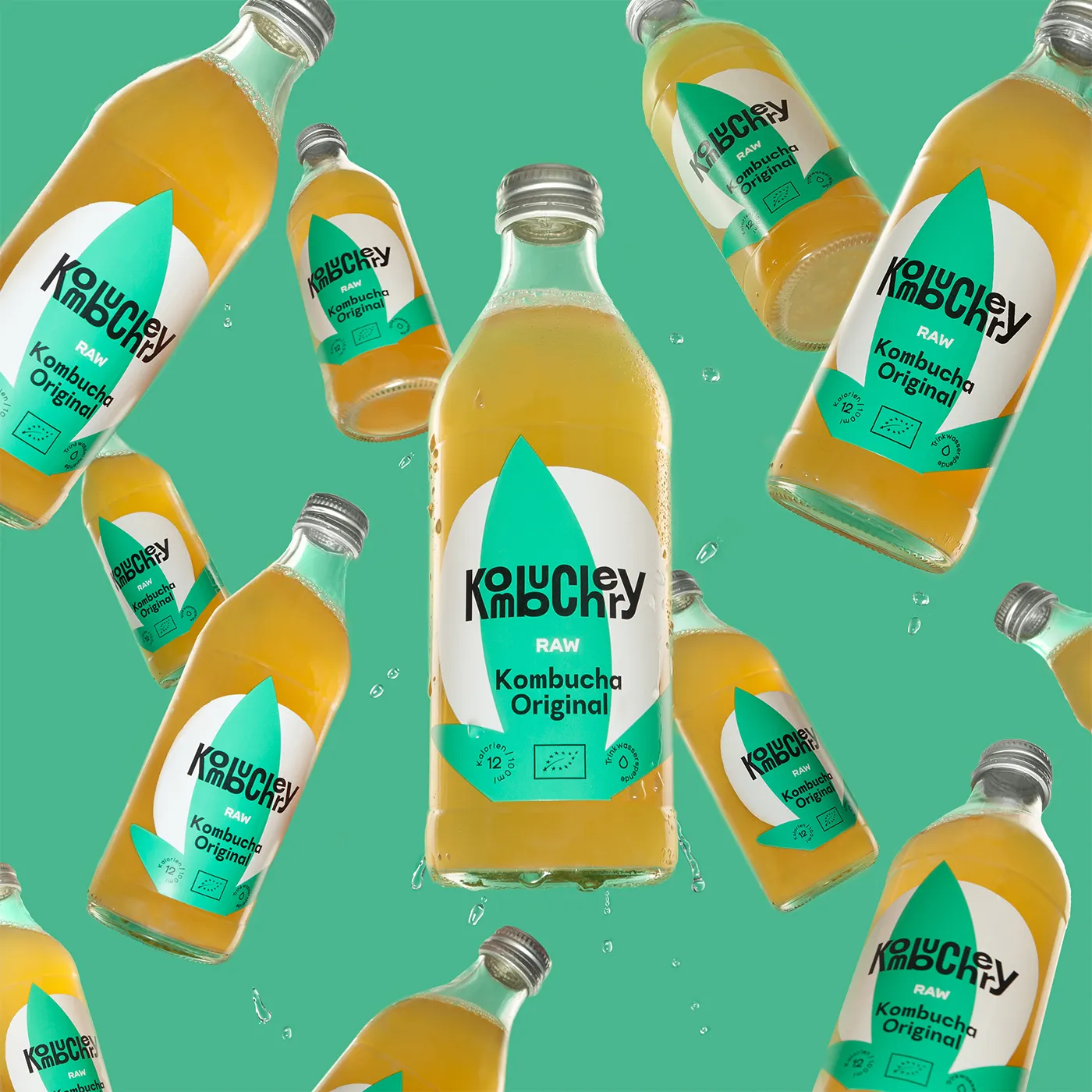 Kombuchery Kombucha Original bottles arranged in a repeating pattern on mint green